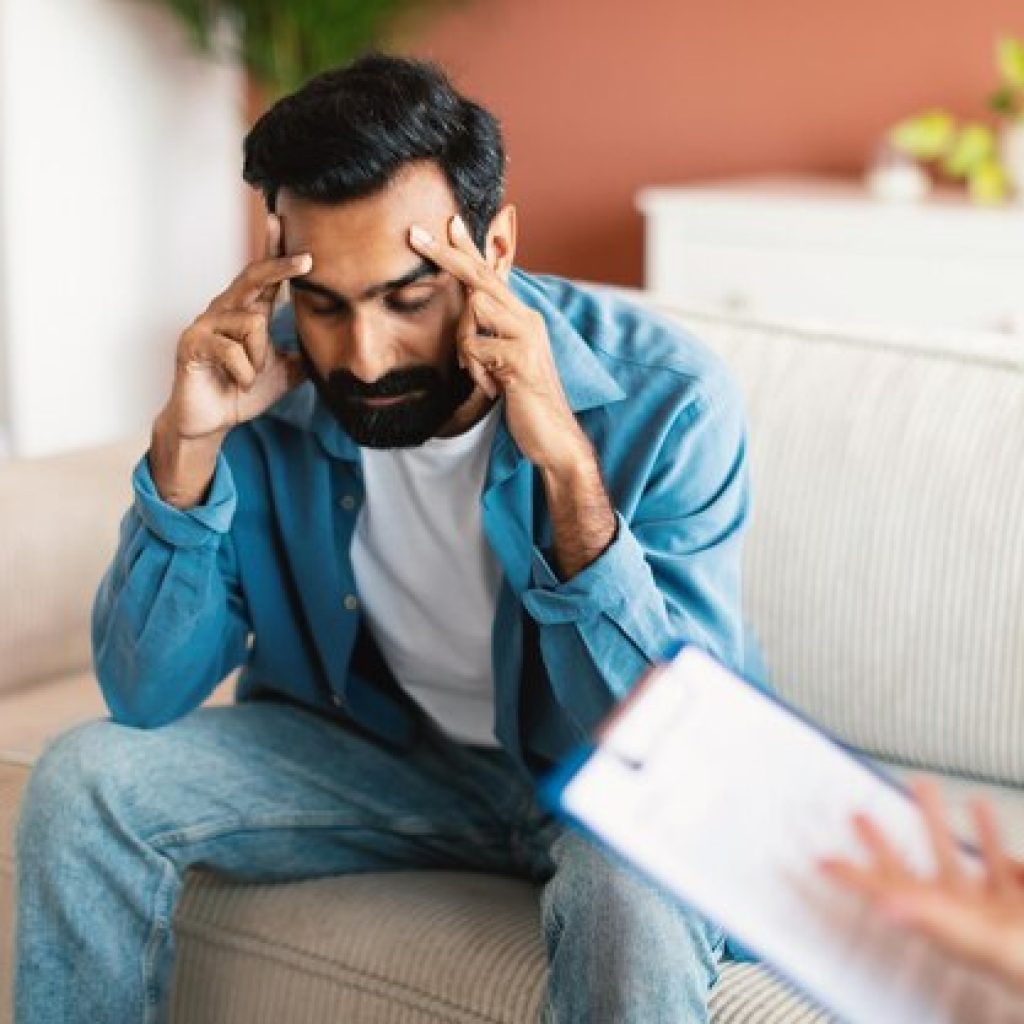 unhappy indian man with depression sitting psychotherapy session indoor 116547 64475.jpg
